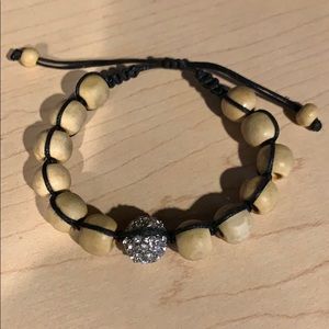 NWOT natural colored beaded adjustable bracelet.